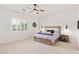 Primary bedroom with shiplap wall, plantation shutters, and hardwood nightstands at 7340 Orchard Harvest Ave, Las Vegas, NV 89131