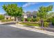 Single-story home with a three-car garage, complemented by a lush green lawn and professional landscaping at 7340 Orchard Harvest Ave, Las Vegas, NV 89131