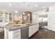 Spacious kitchen with stainless steel appliances and a large island, perfect for gatherings at 7340 Orchard Harvest Ave, Las Vegas, NV 89131