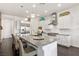 Bright kitchen featuring a large island, stainless steel appliances, and modern white cabinetry at 7340 Orchard Harvest Ave, Las Vegas, NV 89131