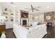 Spacious living room with white built-in shelves and brick fireplace at 7340 Orchard Harvest Ave, Las Vegas, NV 89131