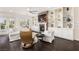 Bright living room with fireplace, white furniture and hardwood floors at 7340 Orchard Harvest Ave, Las Vegas, NV 89131