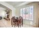 Dining area featuring a four chair dining table and view into the connected living room at 7521 Dry Pines Cir, Las Vegas, NV 89129