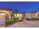 Welcoming front exterior with manicured landscaping, brick accents, and gated entry; perfect curb appeal at 7521 Dry Pines Cir, Las Vegas, NV 89129