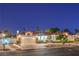Inviting home featuring mature landscaping, a spacious driveway, and a two-car garage at 7521 Dry Pines Cir, Las Vegas, NV 89129