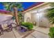 Inviting front courtyard with seating, mature landscaping, and secure gate entrance at 7521 Dry Pines Cir, Las Vegas, NV 89129