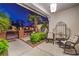 Charming front porch with comfortable seating, lush landscaping, and a welcoming entrance gate at 7521 Dry Pines Cir, Las Vegas, NV 89129