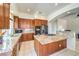 Spacious kitchen with granite countertops, stainless steel appliances, and a functional central island at 7521 Dry Pines Cir, Las Vegas, NV 89129