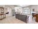 Spacious living area with tile floors, fireplace, and seamless flow to other rooms at 7521 Dry Pines Cir, Las Vegas, NV 89129