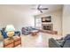 Comfortable living room boasting neutral paint, a fireplace and tile flooring, and lots of seating at 7521 Dry Pines Cir, Las Vegas, NV 89129