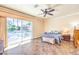 Large main bedroom featuring tile floor, sliding glass doors to exterior deck and pool at 7521 Dry Pines Cir, Las Vegas, NV 89129