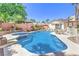 Sparkling pool with attached spa, surrounded by ample patio space for outdoor entertaining at 7521 Dry Pines Cir, Las Vegas, NV 89129