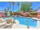 Inviting pool and spa area with outdoor seating, perfect for relaxing and enjoying the sunshine at 7521 Dry Pines Cir, Las Vegas, NV 89129