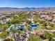 Aerial view of a neighborhood park, featuring lush greenery, playgrounds, and recreational spaces for community enjoyment at 775 Porto Mio Way, Las Vegas, NV 89138