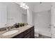 Bathroom features a double vanity with granite countertops and a shower-tub combo at 775 Porto Mio Way, Las Vegas, NV 89138