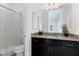 This bathroom features a glass enclosed shower, granite countertops, and modern fixtures at 775 Porto Mio Way, Las Vegas, NV 89138