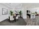 Staged dining room with modern decor, elegant lighting, and access to the kitchen at 775 Porto Mio Way, Las Vegas, NV 89138