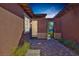 This home's entry has a gated courtyard with brick pavers and a covered entry at 775 Porto Mio Way, Las Vegas, NV 89138