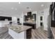 Kitchen featuring granite countertops, a large island, and stainless steel appliances at 775 Porto Mio Way, Las Vegas, NV 89138