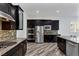Modern kitchen featuring stainless steel appliances and dark wood cabinetry at 775 Porto Mio Way, Las Vegas, NV 89138