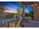 Built-in outdoor grill area with bar seating, perfect for outdoor cooking and entertaining at 775 Porto Mio Way, Las Vegas, NV 89138