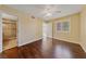 Bright bedroom with hardwood floors, a ceiling fan, window and an en suite bathroom with tile shower at 7950 W Flamingo Rd # 2066, Las Vegas, NV 89147