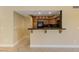 Kitchen bar with dark countertops and wood cabinetry at 7950 W Flamingo Rd # 2066, Las Vegas, NV 89147