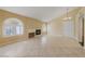 Living room with tile floors, fireplace, and arched windows at 7950 W Flamingo Rd # 2066, Las Vegas, NV 89147