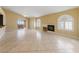 Bright living room with tile floors, recessed fireplace, fan and sliding doors to outdoor balcony at 7950 W Flamingo Rd # 2066, Las Vegas, NV 89147