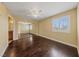 Spacious main bedroom featuring hardwood floors, fan, and sliding mirror closet at 7950 W Flamingo Rd # 2066, Las Vegas, NV 89147