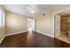 A spacious main bedroom with hardwood floors and a bathroom entrance at 7950 W Flamingo Rd # 2066, Las Vegas, NV 89147