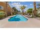 Inviting community pool with lounge chairs and lush landscaping offering a relaxing outdoor oasis at 7950 W Flamingo Rd # 2066, Las Vegas, NV 89147
