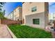 Landscaped backyard with a well-manicured lawn offering a private retreat at 8087 Carpenter Creek Ave, Las Vegas, NV 89113