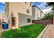 Enclosed backyard showcasing lush green grass, providing a serene outdoor space at 8087 Carpenter Creek Ave, Las Vegas, NV 89113