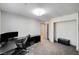 Spacious carpeted bedroom featuring a walk-in closet and modern lighting at 8087 Carpenter Creek Ave, Las Vegas, NV 89113