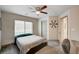 Comfortable bedroom with natural light, ceiling fan and door to hallway at 8087 Carpenter Creek Ave, Las Vegas, NV 89113