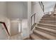 Bright foyer with a tiled floor, stairway with carpet and metal handrail, and high ceilings at 8087 Carpenter Creek Ave, Las Vegas, NV 89113