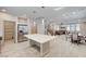 Open-concept layout showcasing a well-appointed kitchen, dining area, staircase, and comfortable living space at 8087 Carpenter Creek Ave, Las Vegas, NV 89113