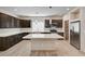 Well-equipped kitchen featuring modern appliances, a kitchen island, and a convenient pantry at 8087 Carpenter Creek Ave, Las Vegas, NV 89113