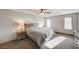 Comfortable main bedroom with neutral tones features a ceiling fan, carpet flooring, and natural light at 8087 Carpenter Creek Ave, Las Vegas, NV 89113