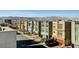 Street view of modern townhouses featuring a well-manicured landscape at 8087 Carpenter Creek Ave, Las Vegas, NV 89113