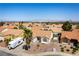 Wide aerial view of community showcasing terra cotta roofs, landscaping, and desert views at 812 Rio Poco Ct, Henderson, NV 89015
