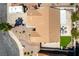 An aerial shot displays a well-maintained property, including a backyard patio, artificial grass, and vehicle parking at 812 Rio Poco Ct, Henderson, NV 89015