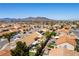 Expansive aerial view of neighborhood showcasing desert landscape and distant mountains at 812 Rio Poco Ct, Henderson, NV 89015