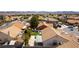 Aerial view showing the back yard featuring a patio, garden and mature trees at 812 Rio Poco Ct, Henderson, NV 89015