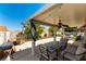 Outdoor patio with ceiling fan, barbecue, and ample seating space at 812 Rio Poco Ct, Henderson, NV 89015