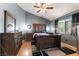 Spacious bedroom featuring vaulted ceilings, wood floors, and a large window at 812 Rio Poco Ct, Henderson, NV 89015