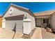 Close-up of a charming single-story home with a landscaped front yard and a spacious two-car garage at 812 Rio Poco Ct, Henderson, NV 89015