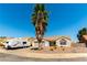 Single-story home featuring RV parking, desert landscaping, and a mature palm tree at 812 Rio Poco Ct, Henderson, NV 89015