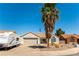 Charming single-story home with desert landscaping, RV parking, and mature palm tree at 812 Rio Poco Ct, Henderson, NV 89015